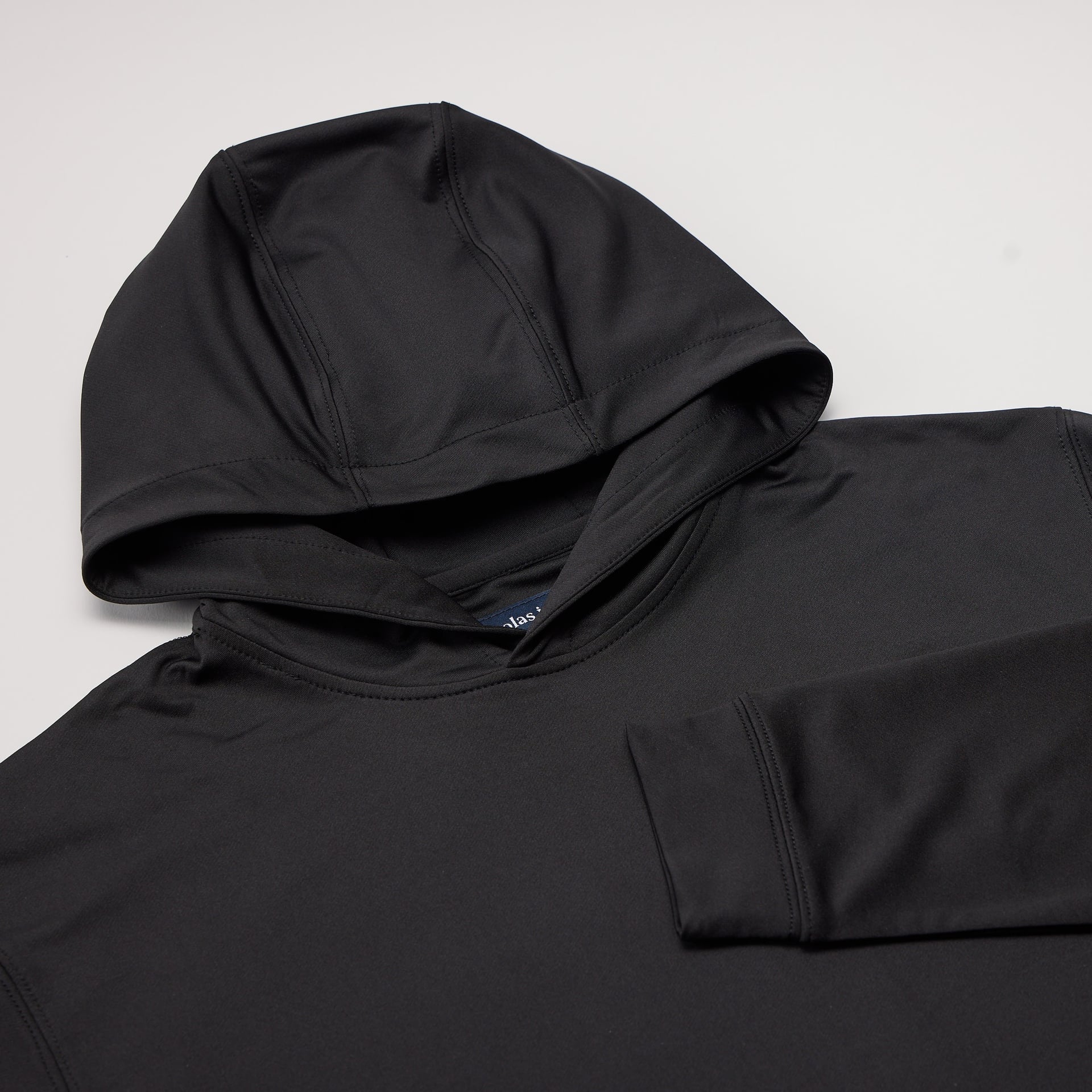 Black hoodie on a light gray background
