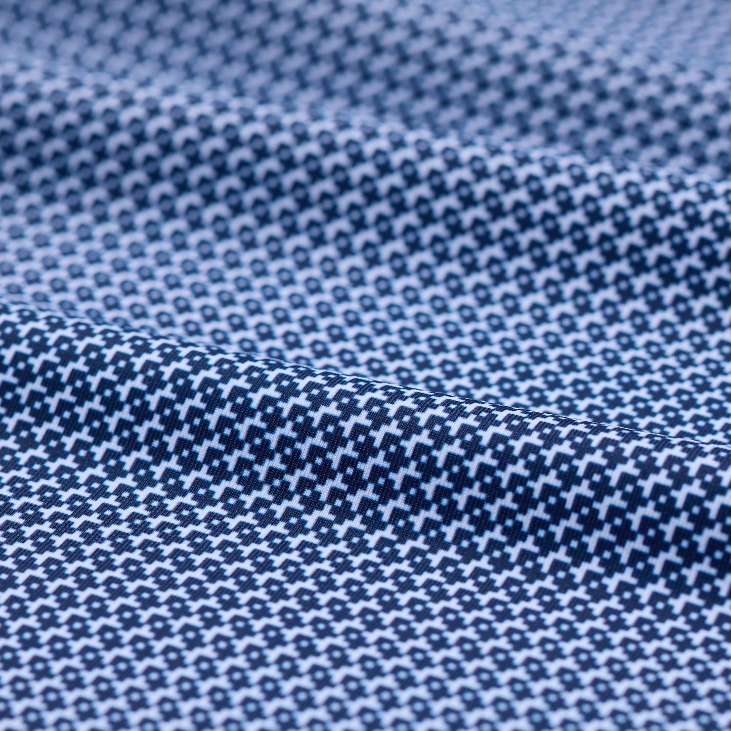 Close-up of blue fabric with a subtle pattern