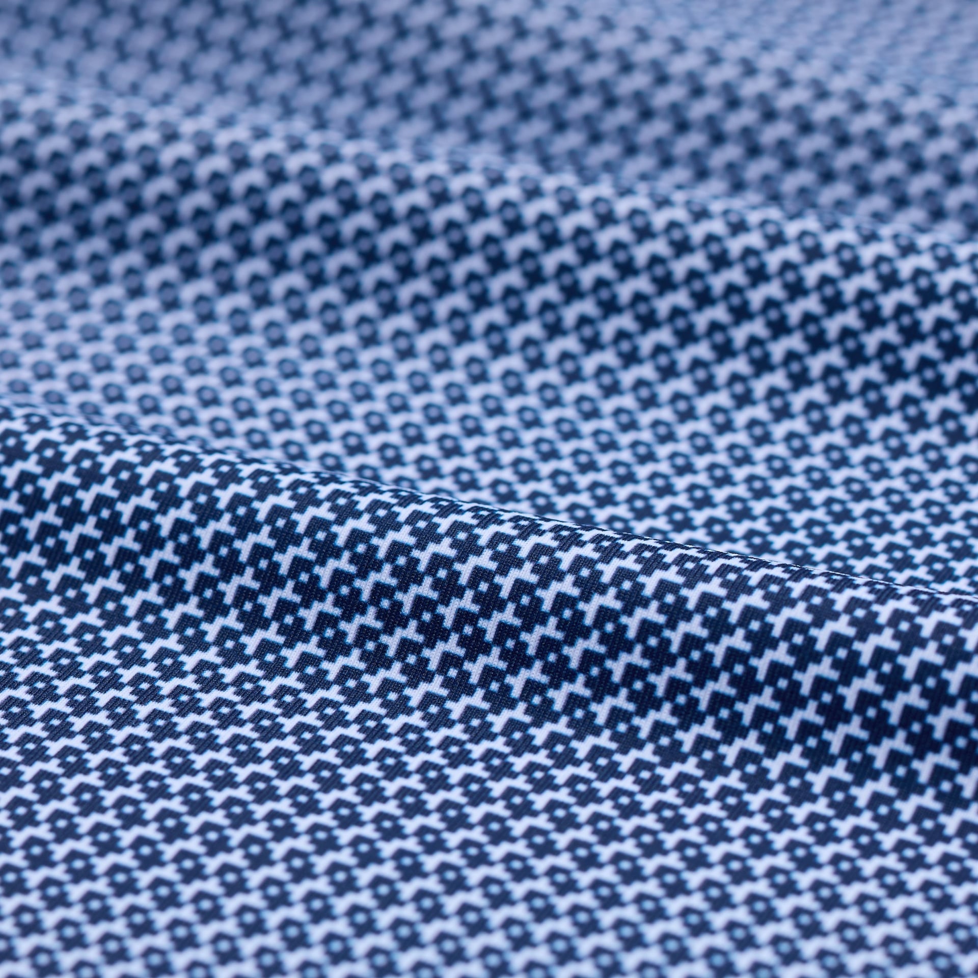 Close-up of blue fabric with a subtle pattern