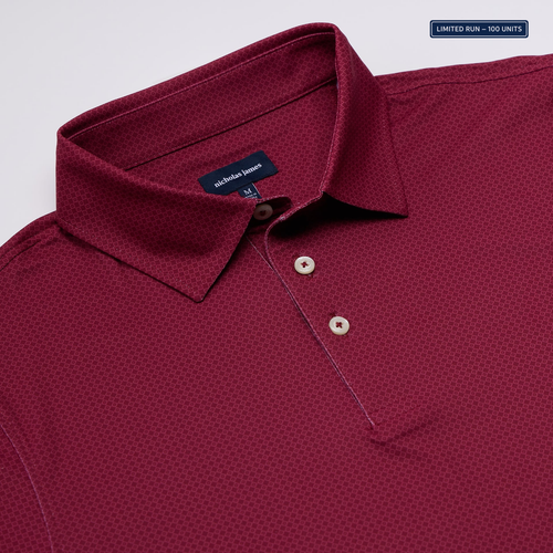 Maroon polo shirt with a close-up of the collar and buttons on a light gray background.
