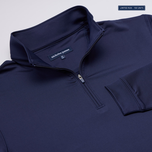 Navy blue pullover with nicholas james label on a light gray background